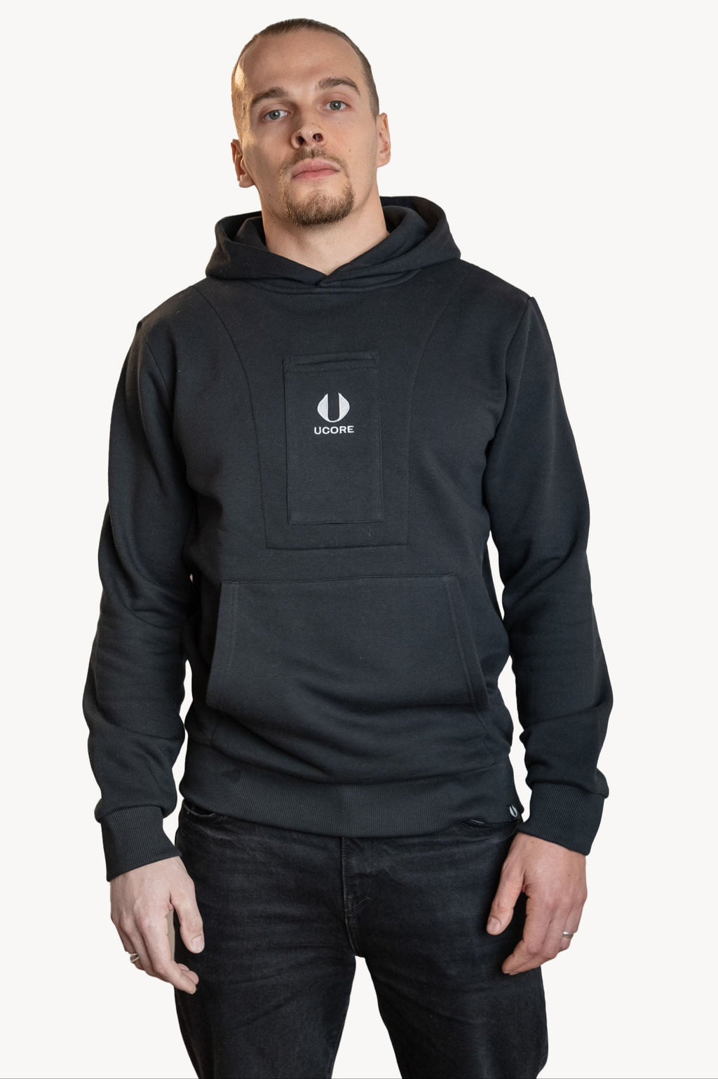 male model wearing black hoodie by ucore