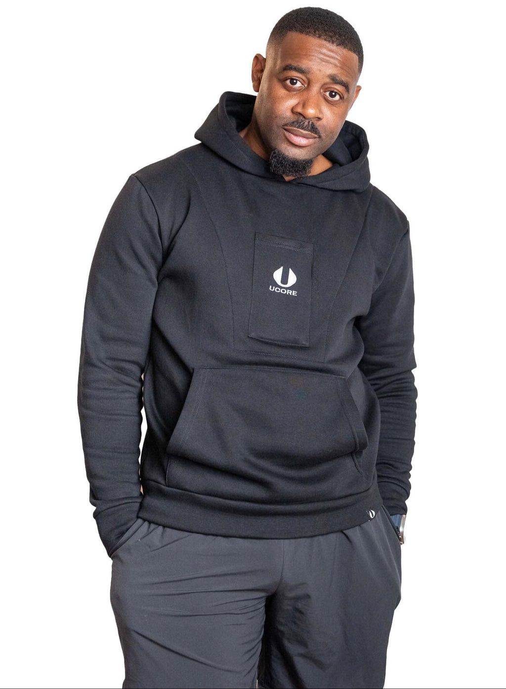 male wearing a black hoodie designed for men