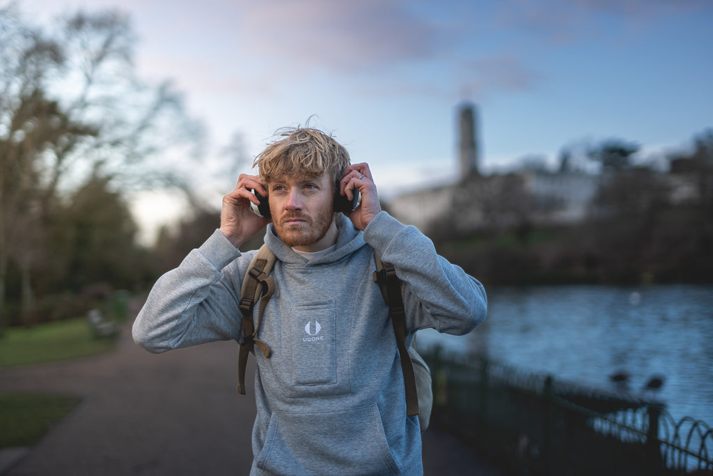 men's grey ucore hoodie being warn outside