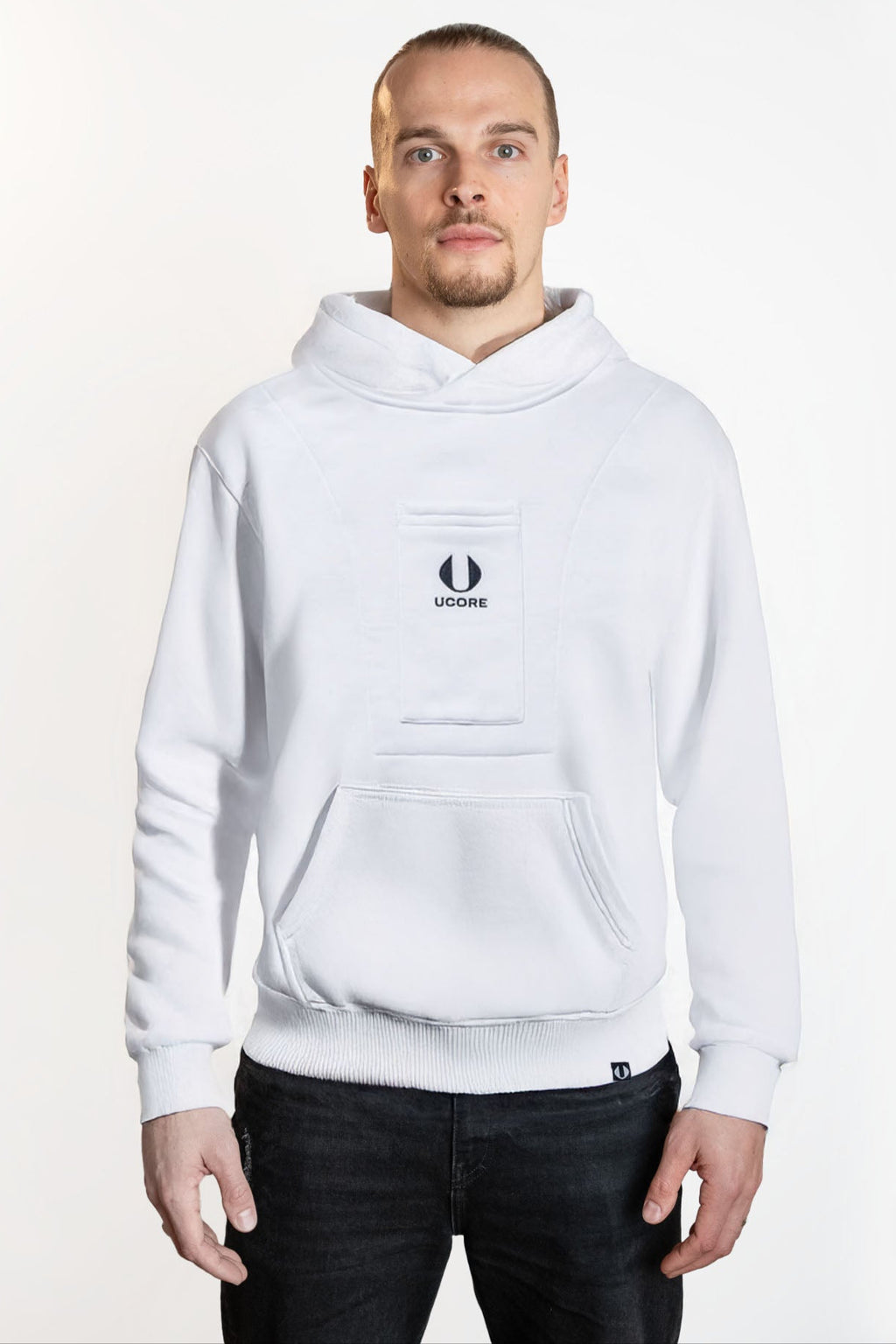 model wearing men's white ucore hoodie