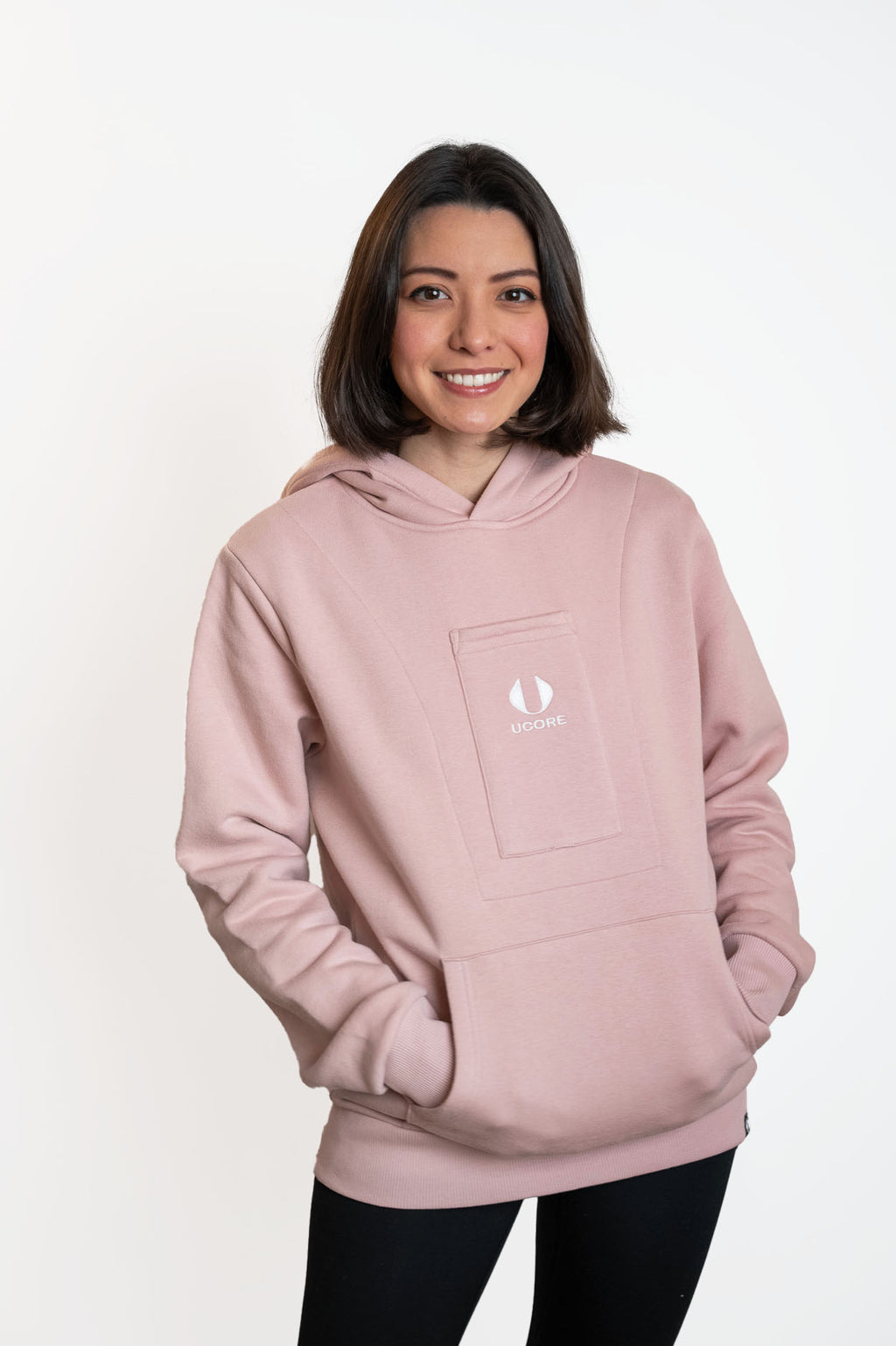 model wearing women's dusky pink hoodie by ucore