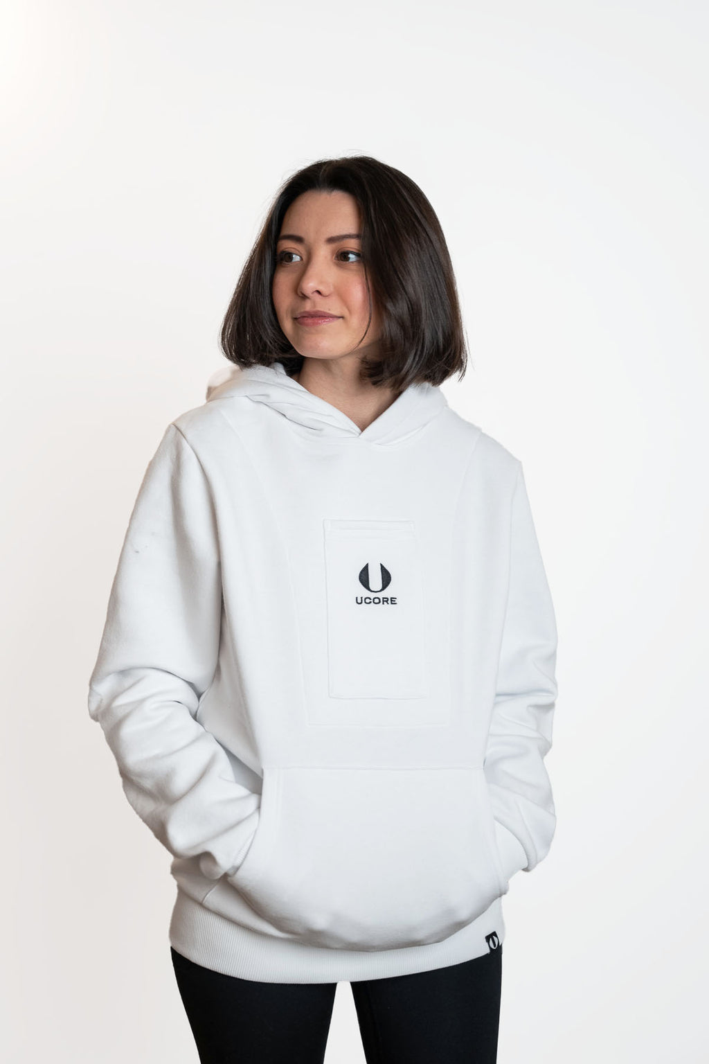 white women's hoodie by ucore being worn by female model